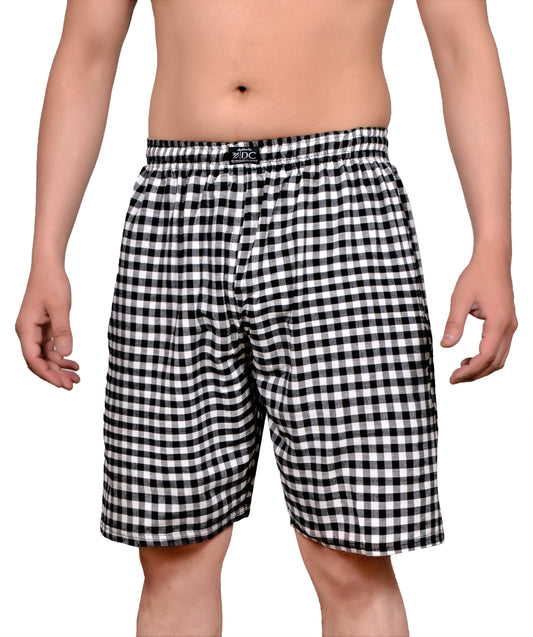 The image displays a pair of stylish, comfortable cotton shorts designed for everyday wear. The shorts are adorned in a classic black and white check pattern, which adds a versatile and timeless touch to the design.