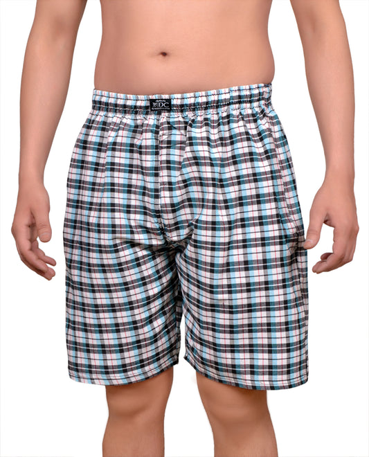 The image displays a pair of blue and white checkered cotton shorts, designed with both side pockets and a back pocket, all highlighted with chain detailing. The elastic waistband is noted for comfort, and the long nada ensures a secure fit.