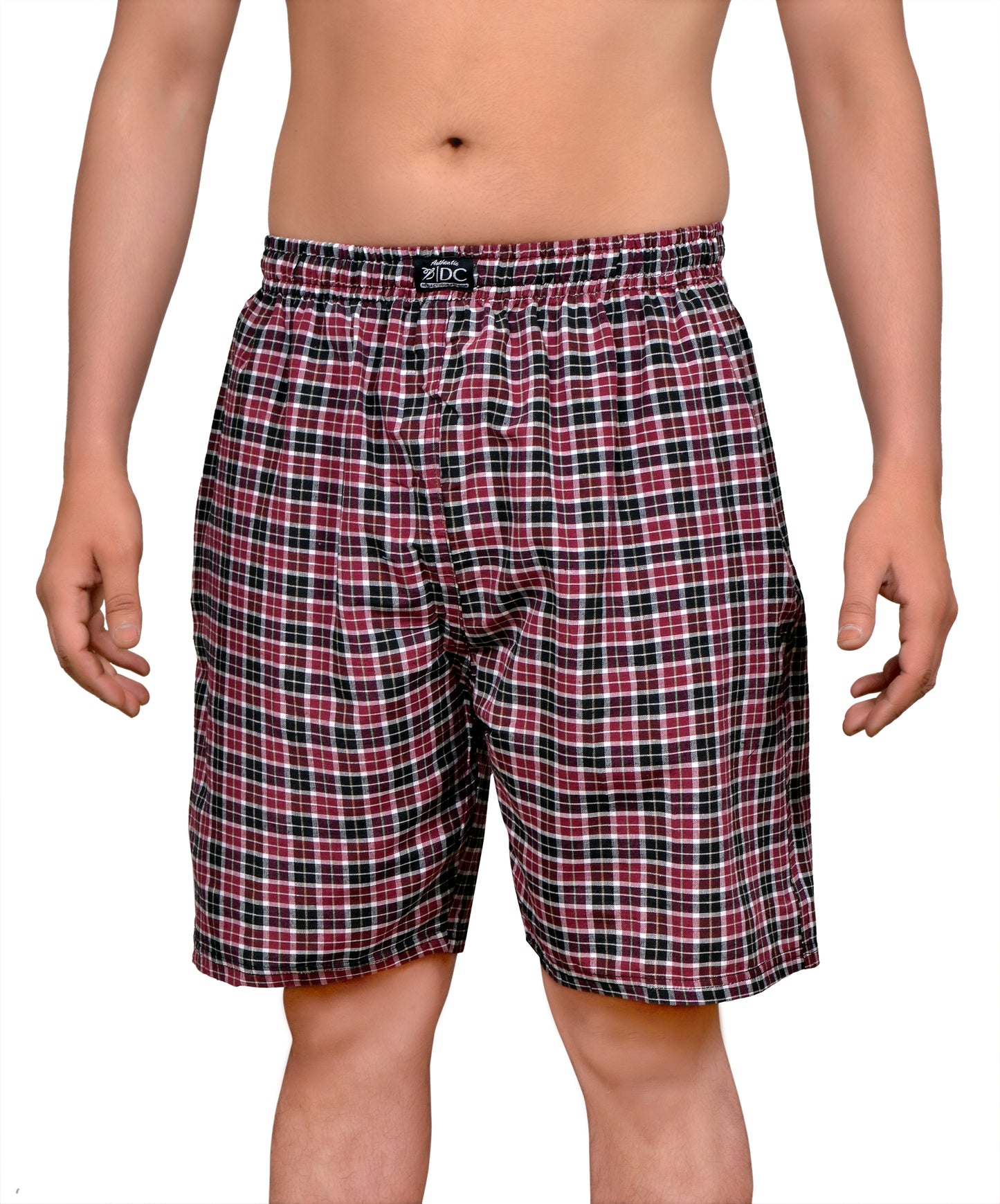 The image displays a pair of red and black checkered cotton shorts, designed for comfort and style. The shorts feature a classic boxershort cut with both side pockets and a single back pocket, each equipped with a chain closure.