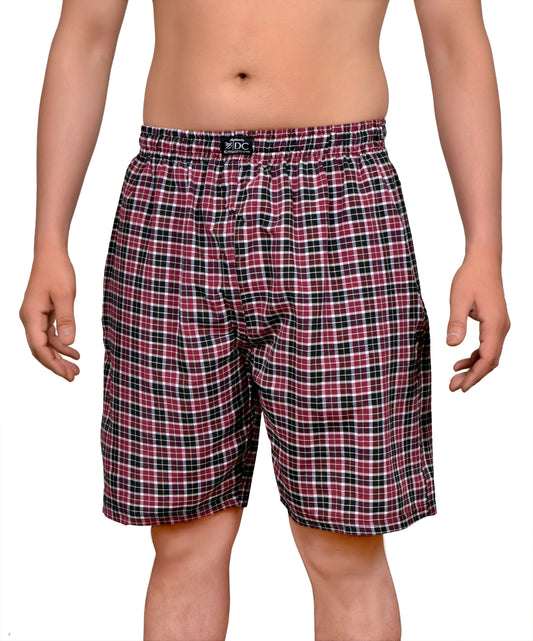 The image displays a pair of red and black checkered cotton shorts, designed for comfort and style. The shorts feature a classic boxershort cut with both side pockets and a single back pocket, each equipped with a chain closure.